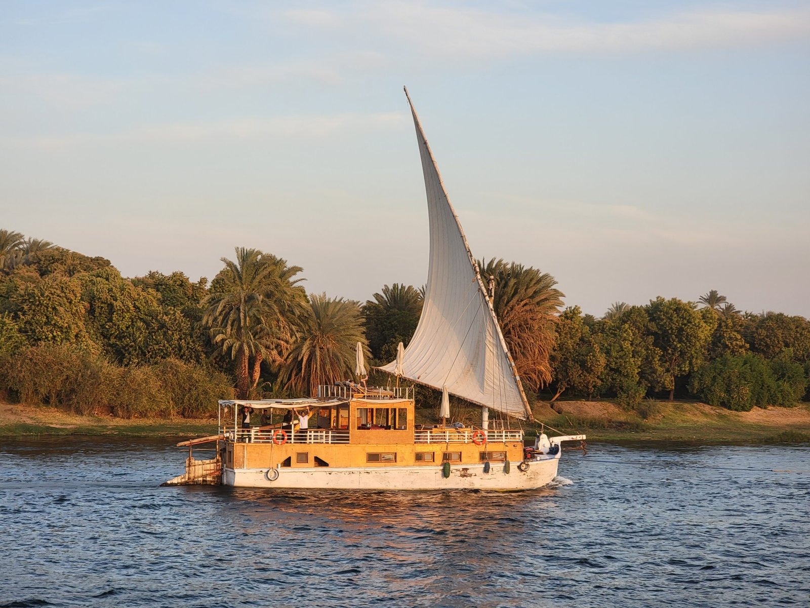 Traditional dahabiya sailboat with lateen sails on the Nile River, Egypt